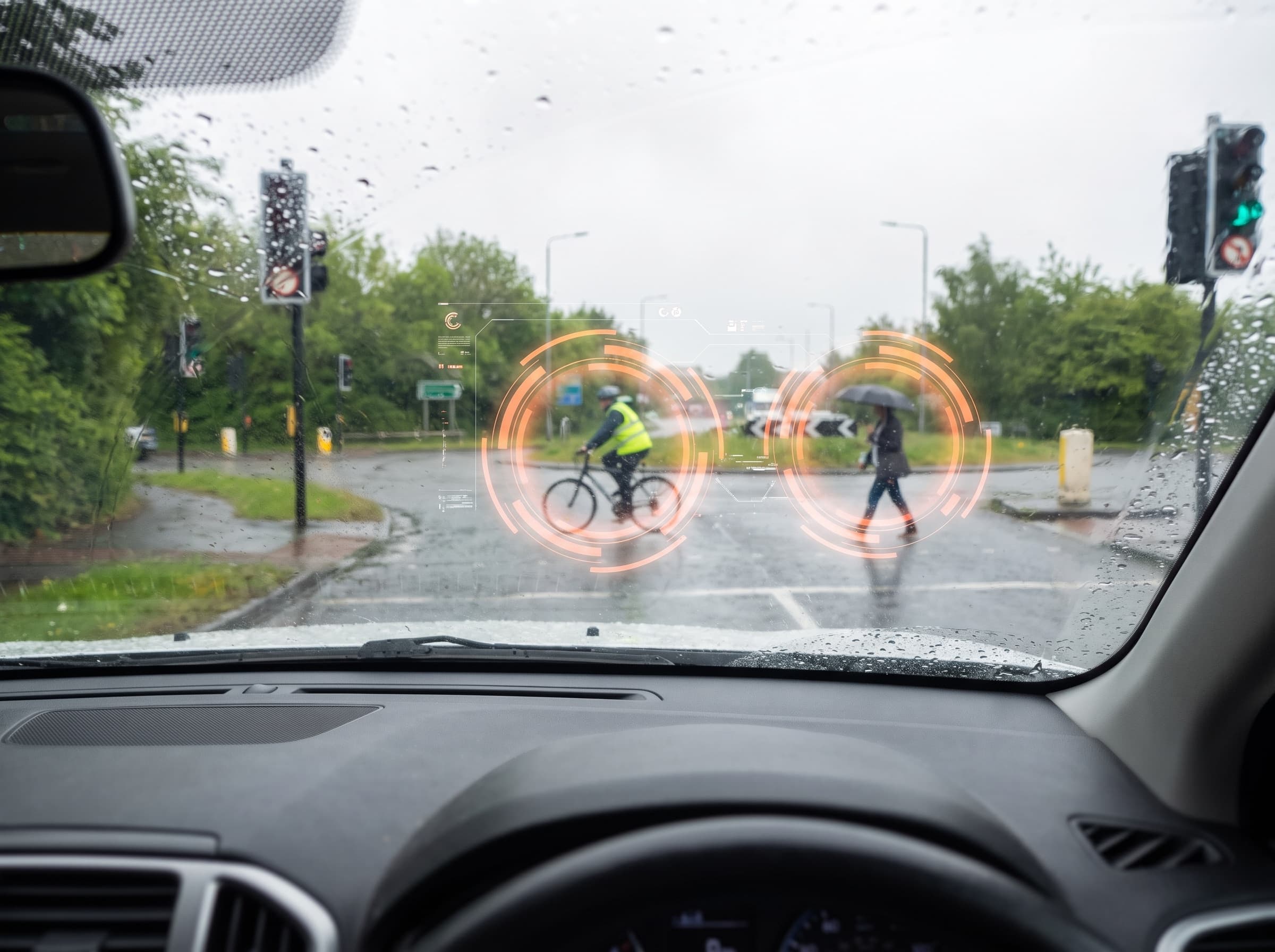 View through a windscreen with hazards highlighted at a junction